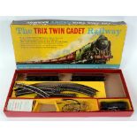 A TRIX TWIN CADET RAILWAY SET comprising a B.R. 0-4-0 tank locomotive, black livery, two suburban