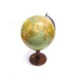 A 13' TERRESTRIAL GLOBE ON STAND naming Persia and Iran amongst the countries, the stained beech