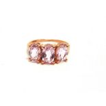 A THREE STONE MORGANITE 9 CARAT GOLD RING finger size L 1/2, 2.2g gross.