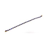 A TWENTY FOUR STONE SAPPHIRE 9 CARAT GOLD LINE BRACELET 17.8cm long, 6.8g gross