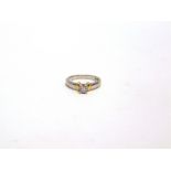 A DIAMOND SINGLE STONE RING the Princess cut of approximately 0.2 carats to a two colour mount