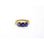 A THREE STONE SAPPHIRE 9 CARAT GOLD RING with pairs of diamonds to the shoulders, finger size M, 1.