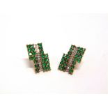 A PAIR OF 9 CART GOLD EMERALD AND DIAMOND CLUSTER EARSTUDS of rectangular shape, 3.7g gross