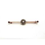 A BAR BROOCH the diamond cluster with vacant setting to the centre, with a stone to either end, 4.8g