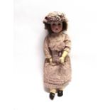 A SCHOENAU & HOFFMEISTER BISQUE SOCKET HEAD DOLL affectionately known as 'Violet', with a