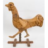 [FAIRGROUND ART]. A CARVED WOODEN ROUNDABOUT RUNNING CHICKEN BY C.J. SPOONER circa 1890, stripped of