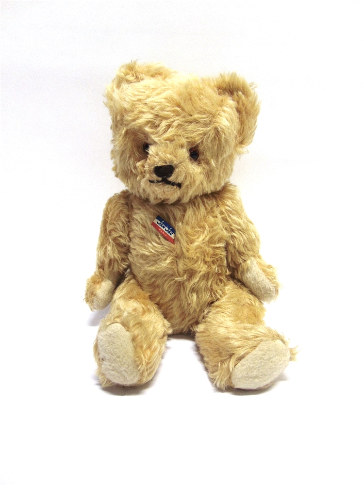 A JAN JAC PALE GOLD MOHAIR TEDDY BEAR with orange plastic eyes and a brown horizontally stitched