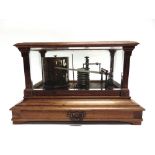A SHORT & MASON BAROGRAPH the brass frame with eight vacuum sections and an ink bottle, in a
