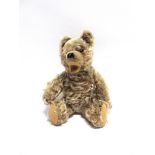 A HERMANN ZOTTY BLONDE MOHAIR TEDDY BEAR with orange glass eyes, a black vertically stitched nose,