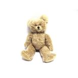 A PALE FAWN MOHAIR TEDDY BEAR probably by Schuco, with fawn glass eyes and a black vertically