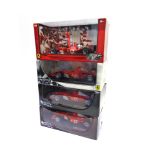 FOUR 1/18 SCALE FERRARI FORMULA 1 RACING CARS comprising a Hot Wheels Ferrari F2002 (M. Schumacher);