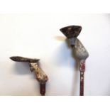 [FAIRGROUND ART]. TWO CAST METAL COCONUT SHY STANDS early 20th century, in unrestored condition, the