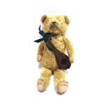 AN ENGLISH GOLD MOHAIR TEDDY BEAR with orange glass eyes and a black horizontally stitched nose,