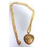 A 1982 HALF SOVEREIGN in a 9 carat gold heart shaped pendant mount, on a 9 carat gold chain, 50cm