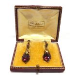 DORRIE ROSSITER, ATTRIBUTED, A PAIR OF ARTS & CRAFTS GARNET SET DROP EARRINGS the cushion shaped