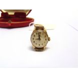 OMEGA, A LADY'S 9 CARAT GOLD WRIST WATCH ON A BRACELET Birmingham 1961, on an unassociated bracelet,