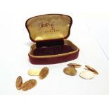 A PAIR OF 9 CARAT GOLD CUFFLINKS Chester 1906(?), the oval panels with chain connectors,