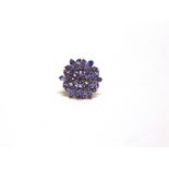 A TANZANITE 9 CARAT GOLD CLUSTER RING finger size N1/2, 5.2g gross