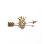 A DIAMOND AND PEARL BAR BROOCH circa 1900, designed as an arrow piercing a diamond set heart with
