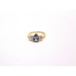 A 9 CARAT GOLD TANZANITE AND CUBIC ZIRCONIA three stone ring, finger size O, 2.2g gross