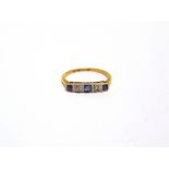 A SAPPHIRE AND DIAMOND FIVE STONE RING stamped '18ct' and 'Plat', finger size M, 1.9g gross