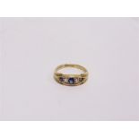 A LATE VICTORIAN FIVE STONE SAPPHIRE AND DIAMOND RING Birmingham 1900, finger size N, 2.8g gross