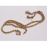 A 9 CARAT GOLD HOLLOW ROPE LINK CHAIN with a two tassle frontispiece, 51cm ling, 22.9g gross
