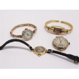 A LADY'S 18 CARAT GOLD WRIST WATCH ON A STRAP a lady's 9 carat gold wrist watch, with a mother of