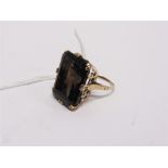 A SMOKY QUARTZ SINGLE STONE RING stamped 9ct, 10g gross, finger size N, cased