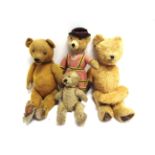 FOUR ASSORTED TEDDY BEARS comprising an English gold mohair teddy bear, with orange glass eyes (