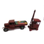 TWO TRI-ANG PRESSED STEEL TOYS comprising a tipper lorry, 48cm long; and a crane, each playworn.
