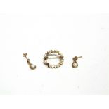A CULTURED PEARL CIRCLET BROOCH stamped '375', 2.2cm diameter; with a pair of cultured pearl and