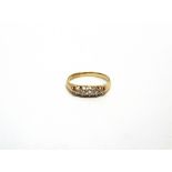 A FIVE STONE DIAMOND 18 CARAT GOLD RING Birmingham 1912, finger size P 1/2, 2.9g gross