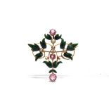A PINK TOURMALINE, SEED PEARL AND GREEN ENAMEL BROOCH circa 1900, with sprays of green leaves at the