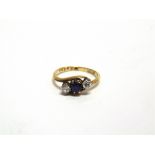 A THREE STONE DIAMOND AND SAPPHIRE RING indistinctly stamped, the transitional cuts totalling