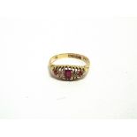 A SYNTHETIC RUBY AND DIAMOND 18 CARAT GOLD RING London 1913, finger size T, 3.4g gross