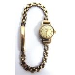 LONGINES, A LADYS 9 CARAT GOLD MECHANICAL WRIST WATCH on a 9 carat gold bracelet, 11g gross