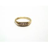 A FIVE STONE DIAMOND 18 CARAT GOLD RING date letter rubbed, finger size U1/2, 3.7g gross