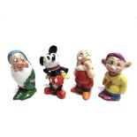 FOUR WALT DISNEY CERAMIC TOOTHBRUSH HOLDERS in the form of Mickey Mouse, Doc, Sleepy and Dopey, each