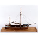 A MODEL OF A RIVER TRADER of part-painted wooden construction, 61.6cm long (inclusive of bow-