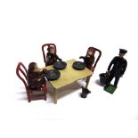 AN F.G. TAYLOR LEAD CHIMPS' TEA PARTY SET comprising a keeper, three chimpanzees, a table, three