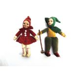 TWO NORAH WELLINGS CLOTH SKI-ING DOLLS each with painted faces and integrally fashioned costumes,