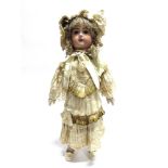 A LARGE JUMEAU BISQUE SOCKET HEAD DOLL with a long crimped blonde wig, fixed blue-grey glass