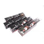 TWELVE 1/43 SCALE MINICHAMPS MCLAREN FORMULA 1 RACING CARS each mint or near mint and boxed.