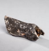 An ancient Dutch kolf club head, hollow lead alloy, remnant of wooden shaft visible within,