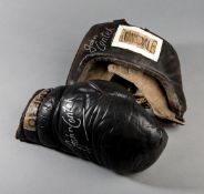 A headguard and a boxing glove both signed by John Conteh, both items used by Conteh in training,