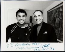 A photograph signed by Muhammad Ali and with a presentation inscription to the movie actor Sir