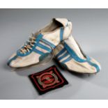 A vintage pair of Adidas athletics spikes circa 1960, white & light blue leather,