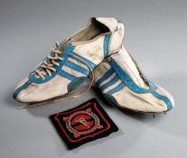 A vintage pair of Adidas athletics spikes circa 1960, white & light blue leather,