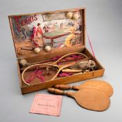 A rare wooden boxed set of "Tennis de Salon" circa 1900, containing two strung rackets,